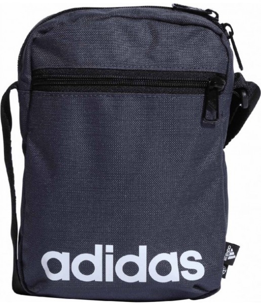 Granatowa torebka na ramię Adidas Essentials Organizer 2 l z białym logo, przednią kieszenią na zamek i regulowanym paskiem