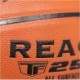Pomarańczowa piłka do koszykówki Spalding React TF-250 76802Z r. 6 z czarnymi rowkami i logo Spalding